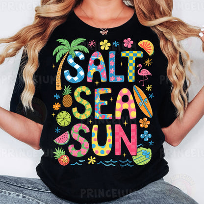 a woman wearing a black shirt that says salt sea sun