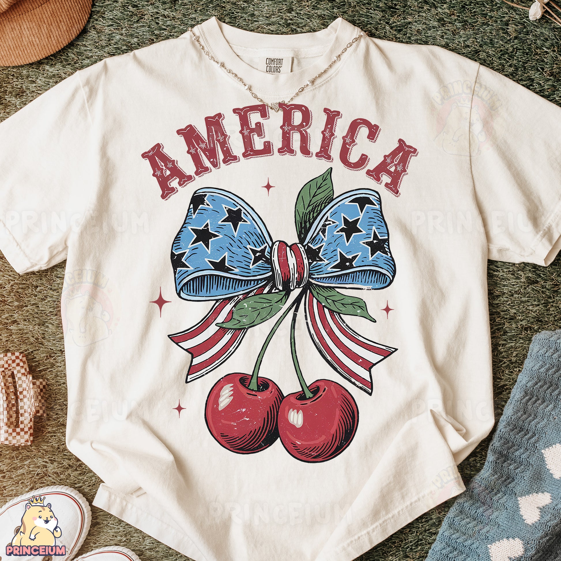 a t - shirt with a bow and two cherries on it