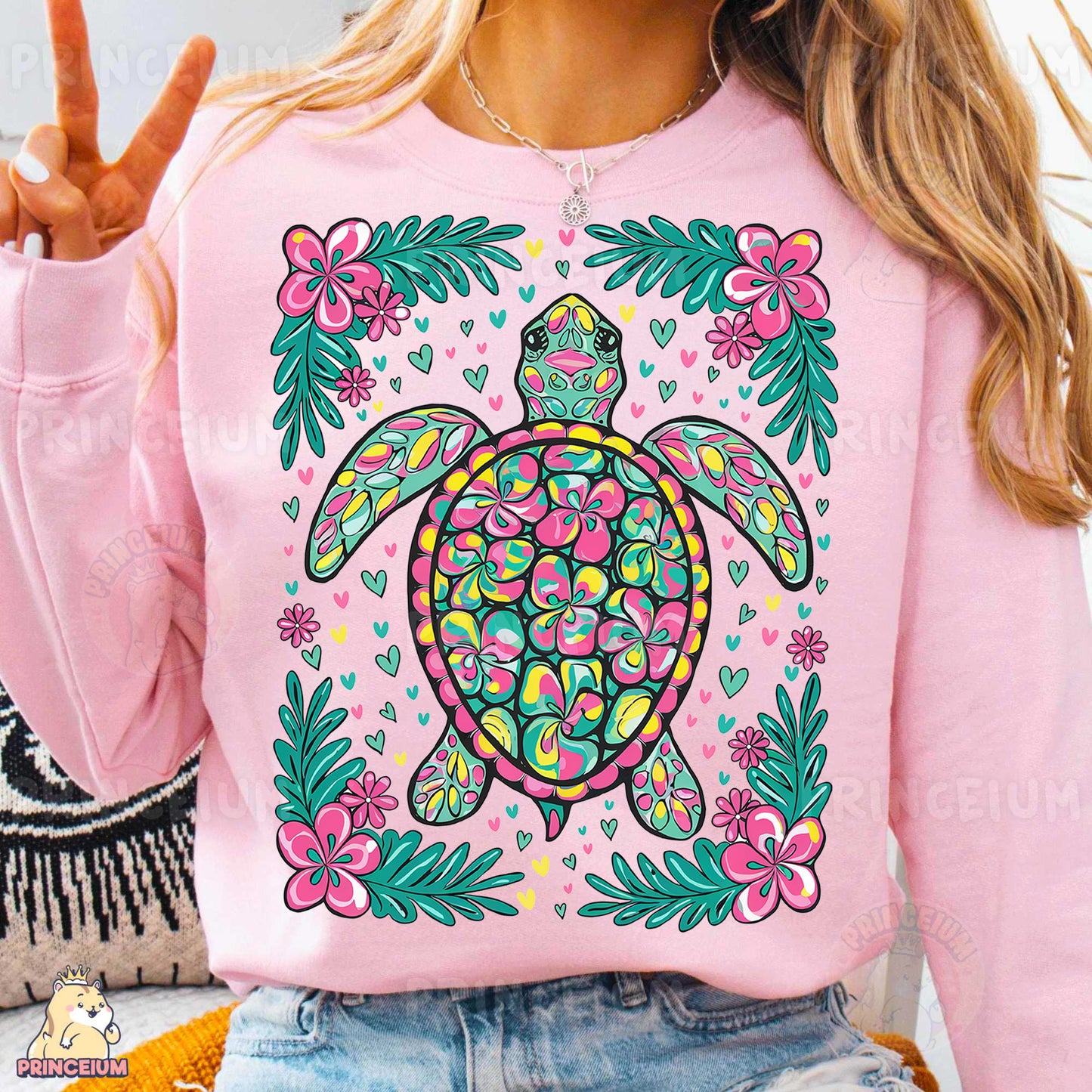 a woman wearing a pink turtle sweatshirt with flowers on it