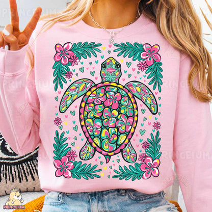 a woman wearing a pink turtle sweatshirt with flowers on it
