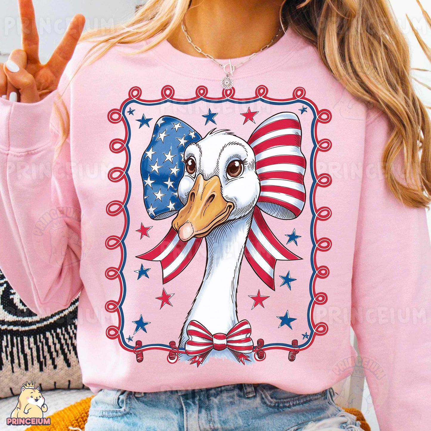a woman wearing a pink sweater with an eagle on it
