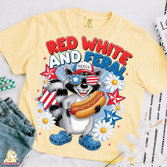 a shirt with a raccoon eating a hot dog