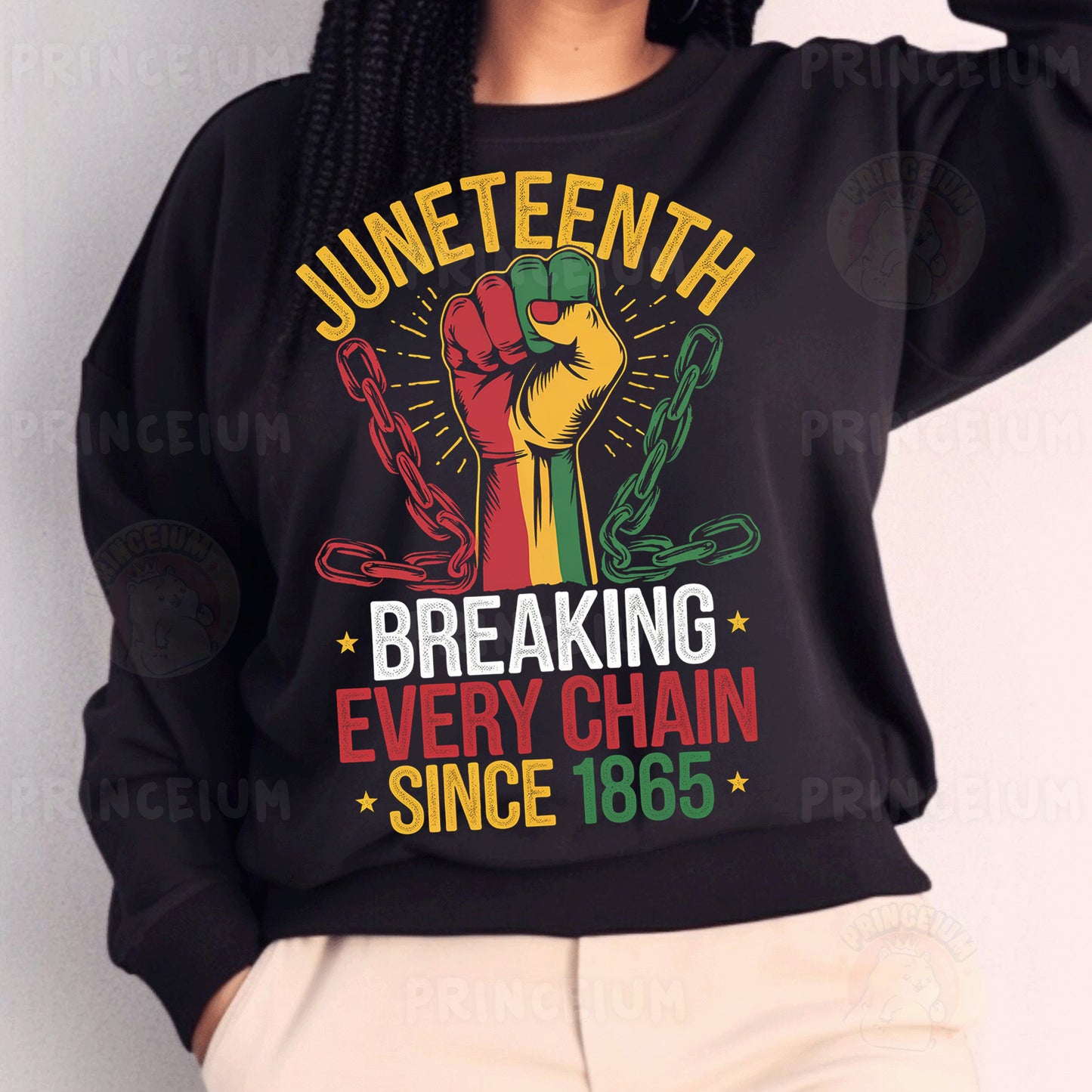 a woman wearing a black sweatshirt with a fist on it