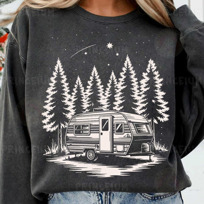 a woman wearing a sweatshirt with a camper on it