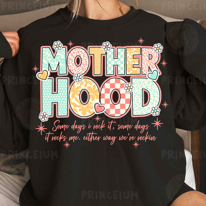 a woman wearing a black shirt that says motherhood