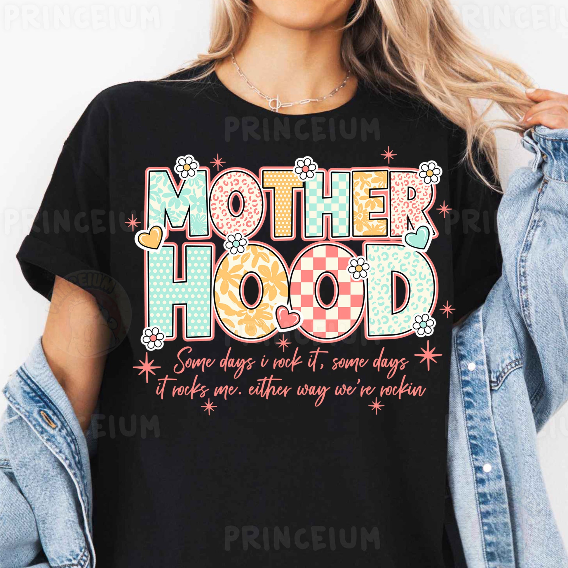 a woman wearing a t - shirt that says motherhood