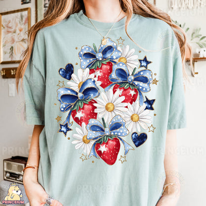 a woman wearing a t - shirt with a strawberry and daisies on it