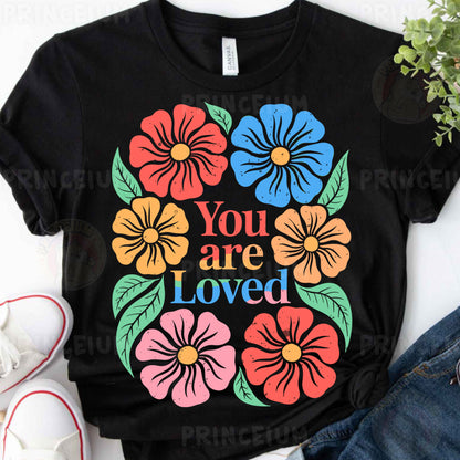 a t - shirt that says you are loved surrounded by flowers