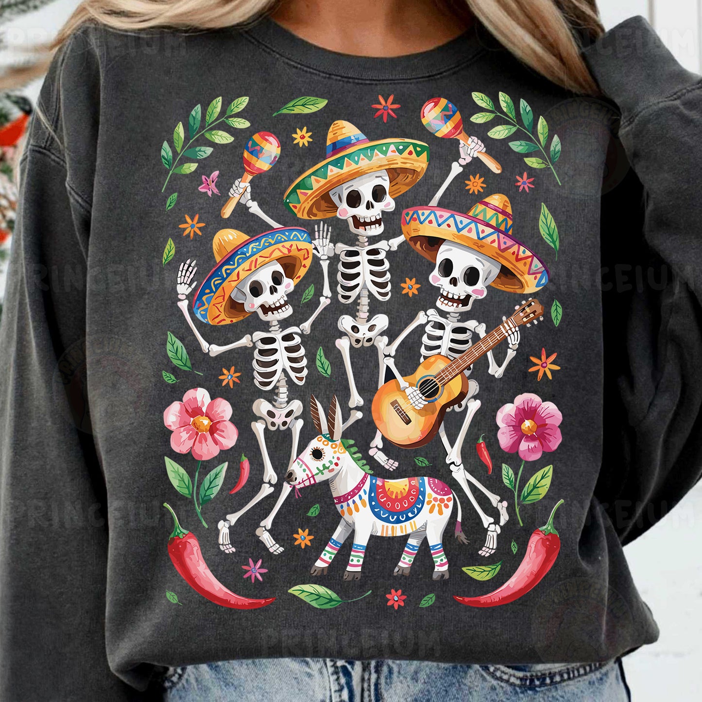 a woman wearing a black sweatshirt with a mexican skeleton design