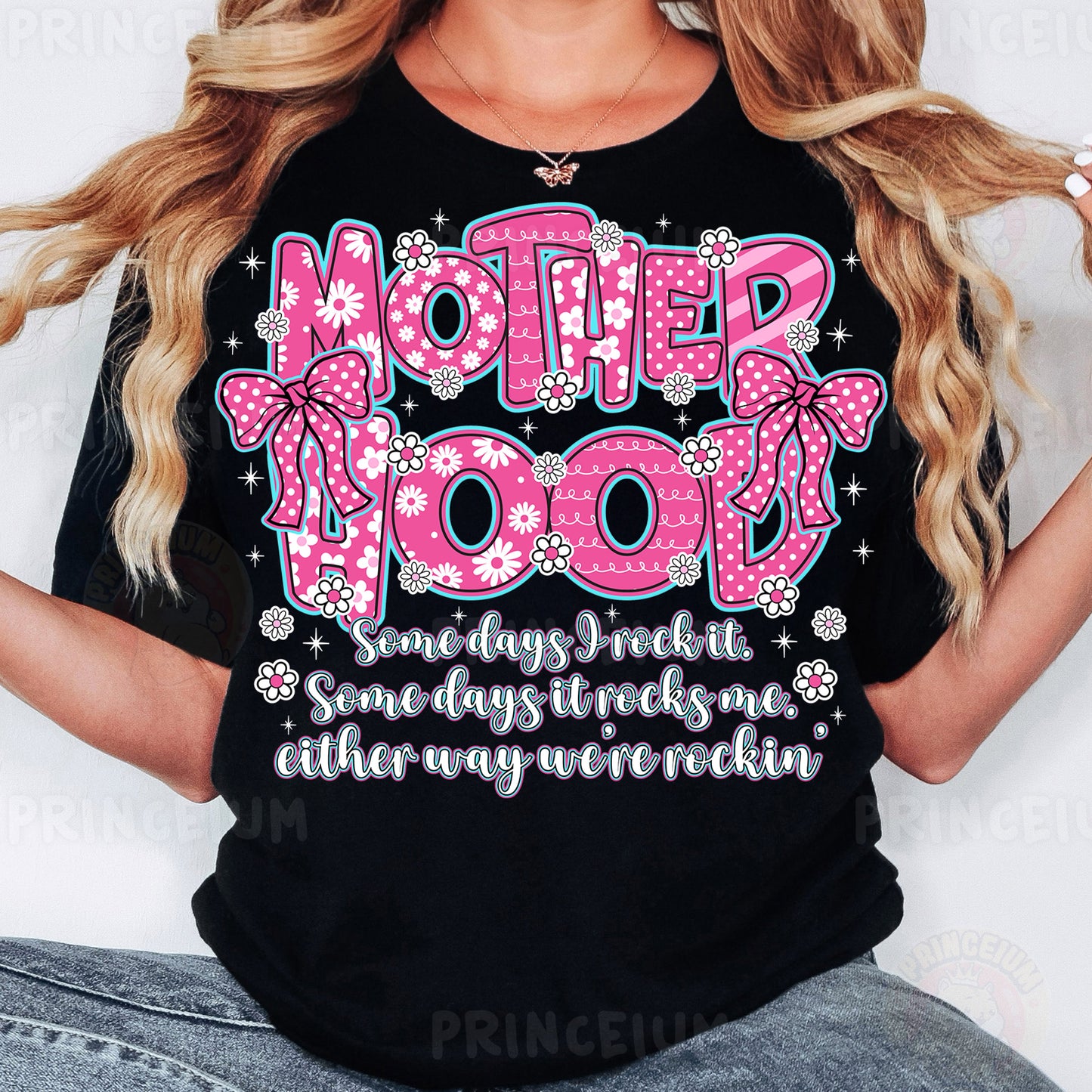 a woman wearing a t - shirt that says motherhood