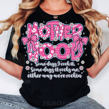 a woman wearing a t - shirt that says motherhood