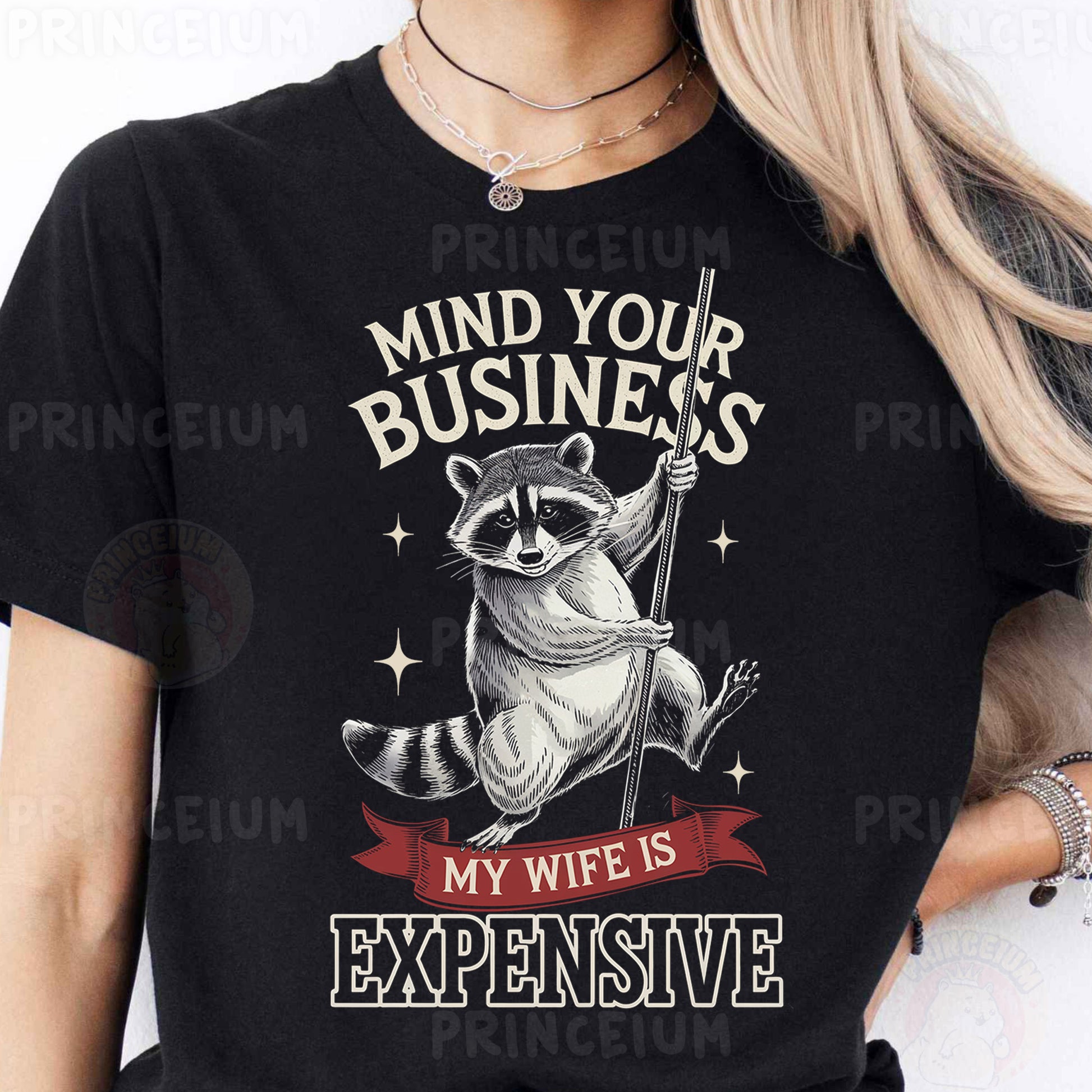 a woman wearing a black shirt with a raccoon on it