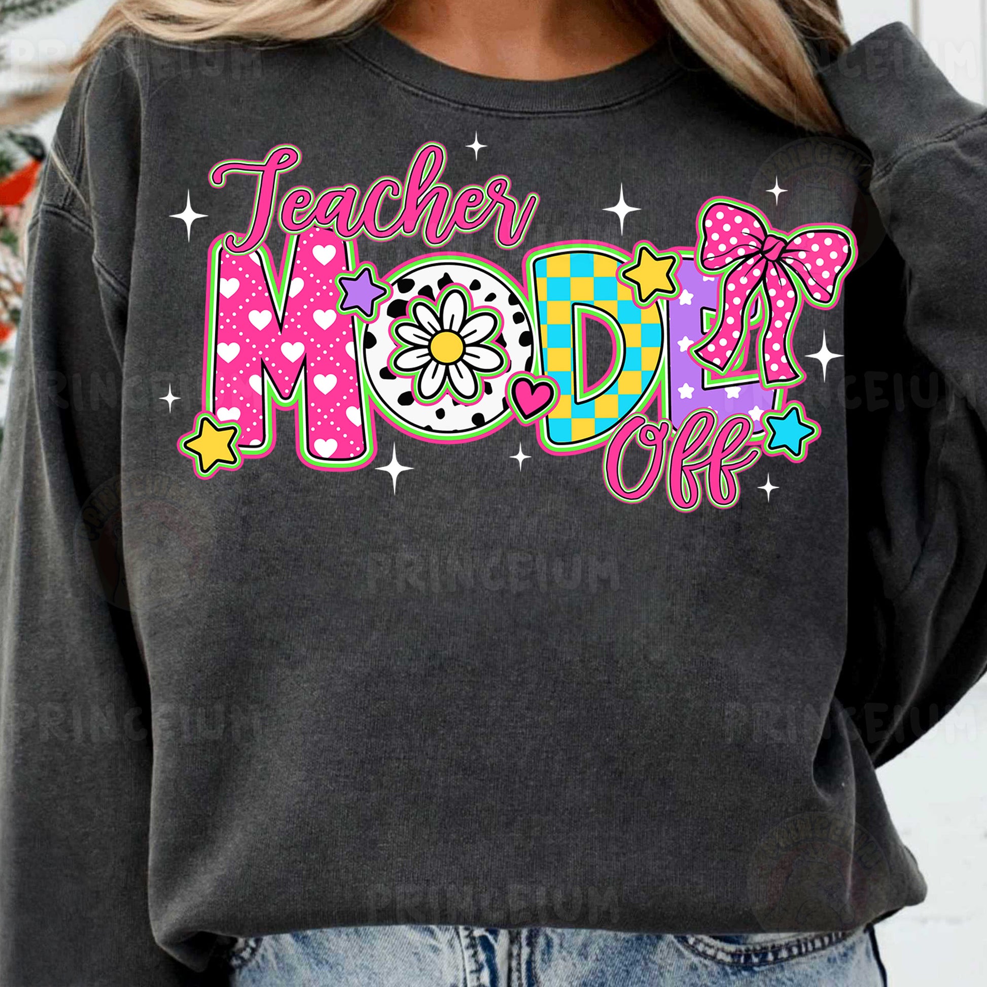 a woman wearing a black teacher mom sweatshirt