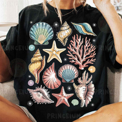 a woman sitting on a couch wearing a black shirt with sea shells and starfish