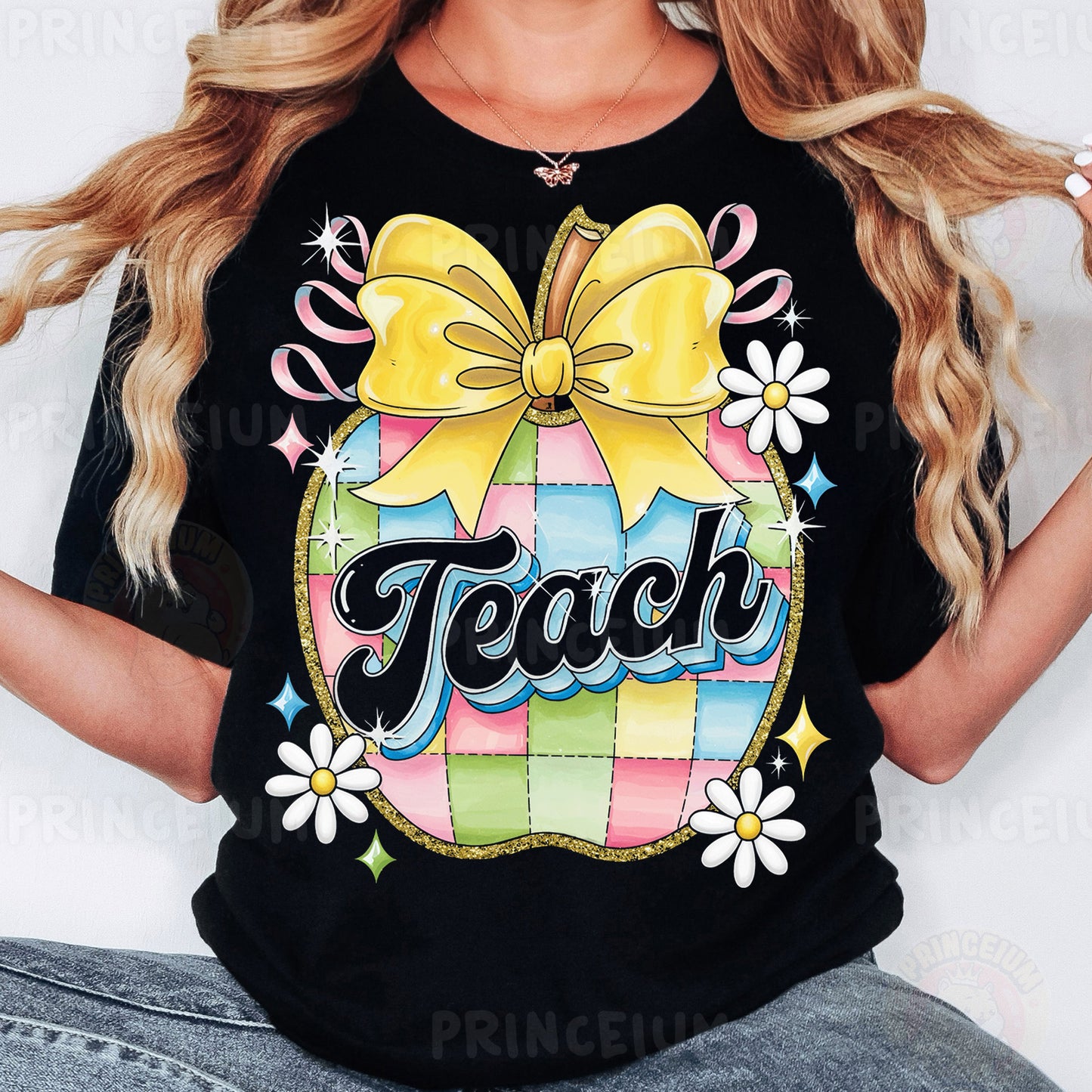 a woman wearing a black teacher shirt with a yellow bow
