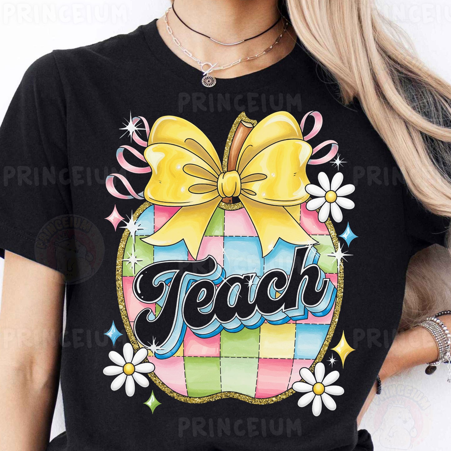 a woman wearing a black teacher shirt with a yellow bow