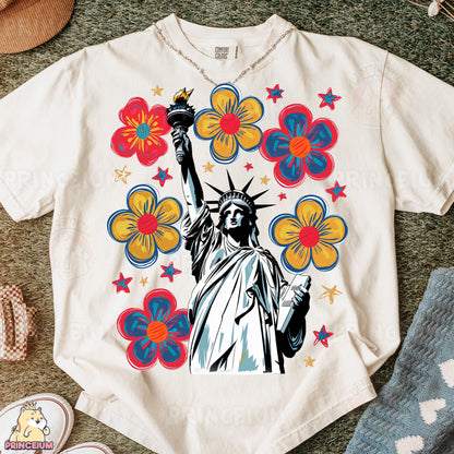 a t - shirt with the statue of liberty surrounded by flowers