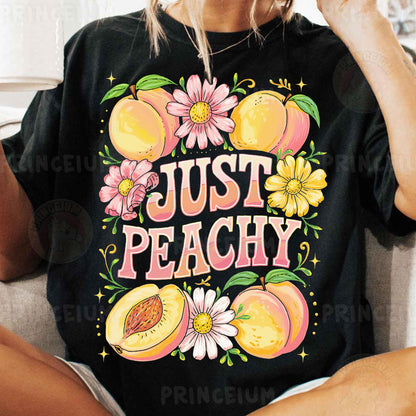 a woman sitting on a couch wearing a t - shirt that says just peachy