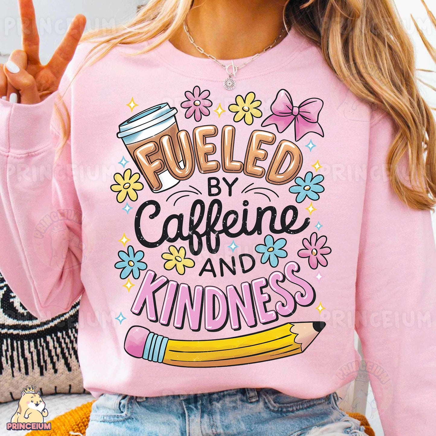 a woman wearing a pink sweatshirt that says fueled by caffeine and kind of