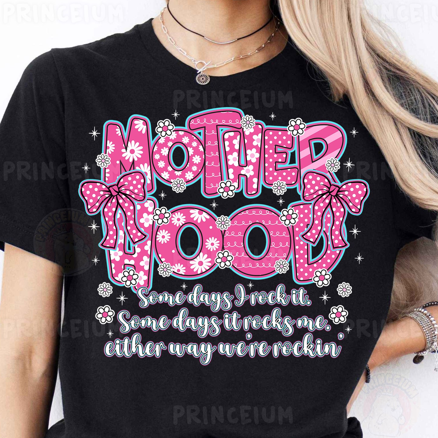 a woman wearing a t - shirt that says motherhood