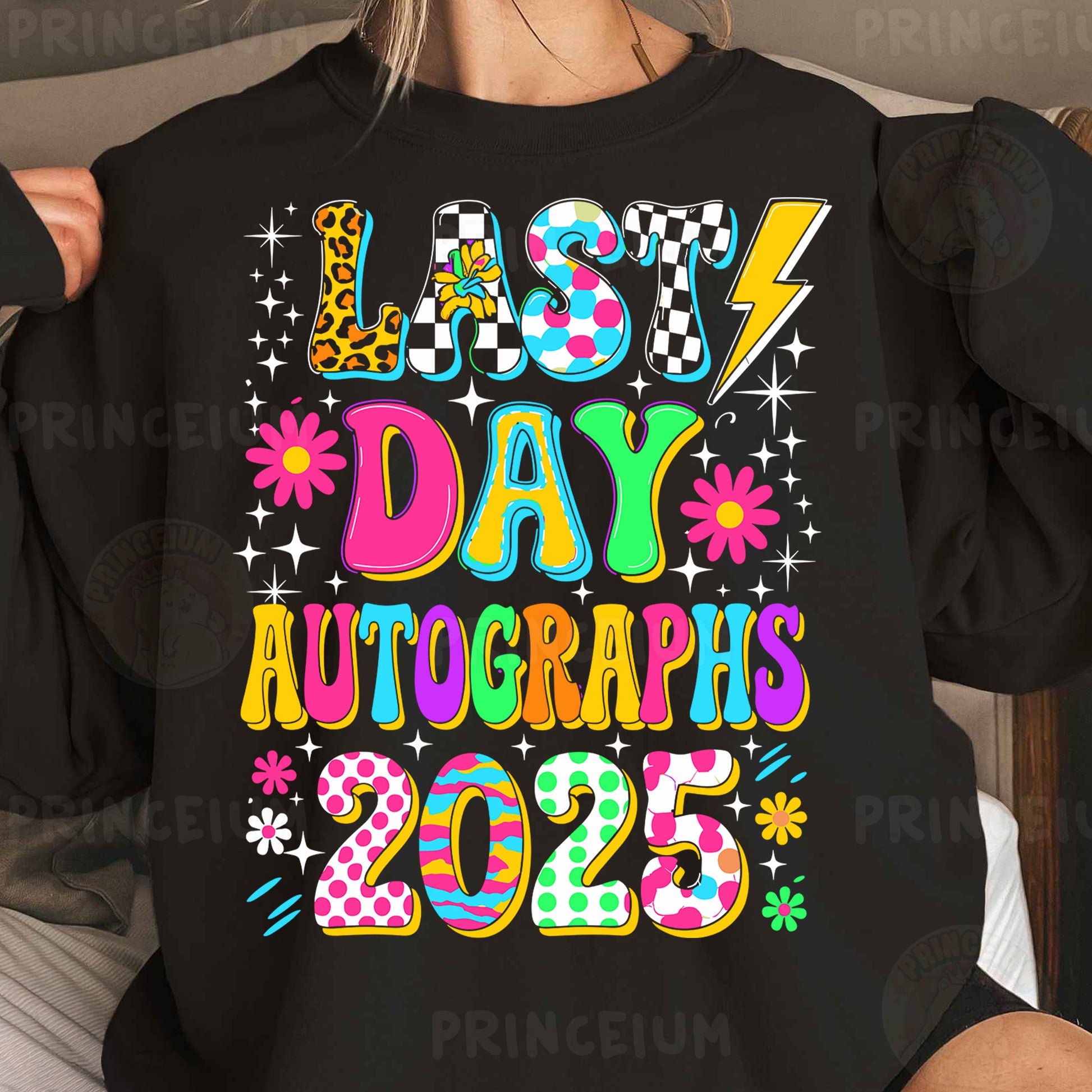 a woman wearing a black shirt that says last day autographs 2055