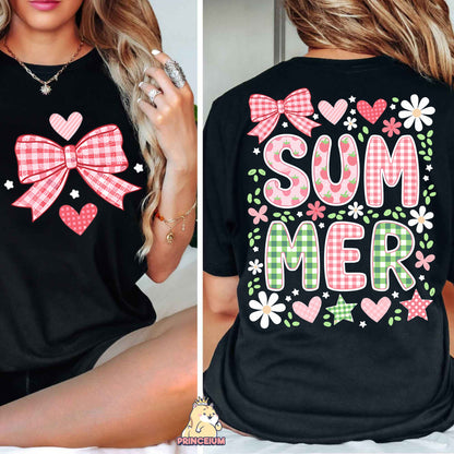 a woman wearing a black shirt with a pink bow on it