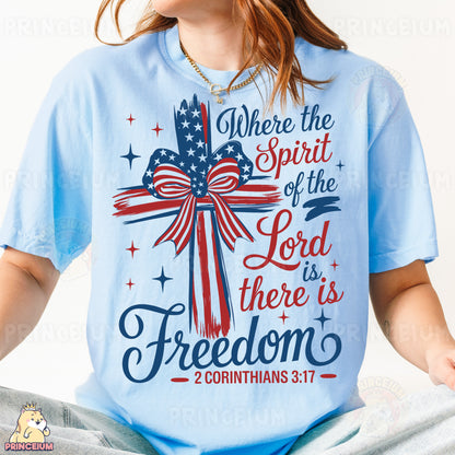 a woman wearing a blue shirt with a cross on it
