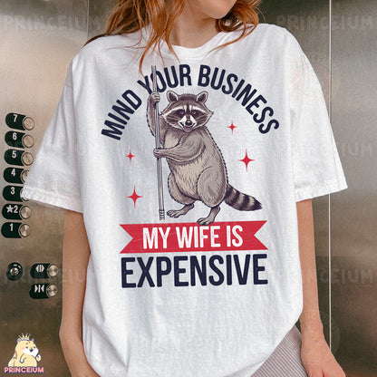 a woman wearing a white shirt with a raccoon on it