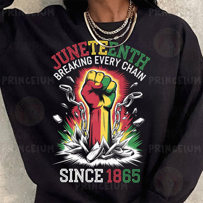 a woman wearing a black shirt with a fist on it