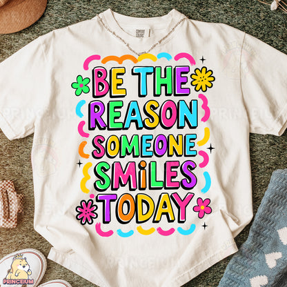 a t - shirt that says be the reason someone smiles today