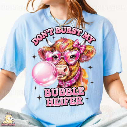 a woman wearing a blue shirt with a pink bubble in her mouth