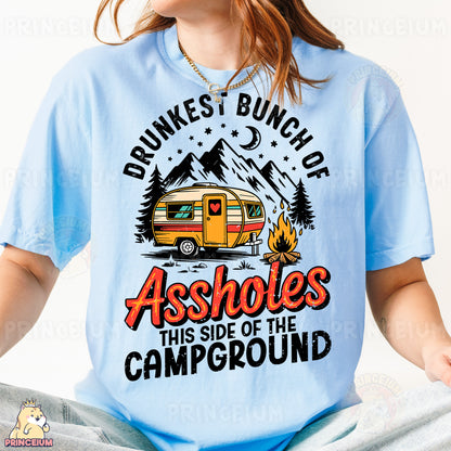 a woman wearing a blue shirt with a camper on it