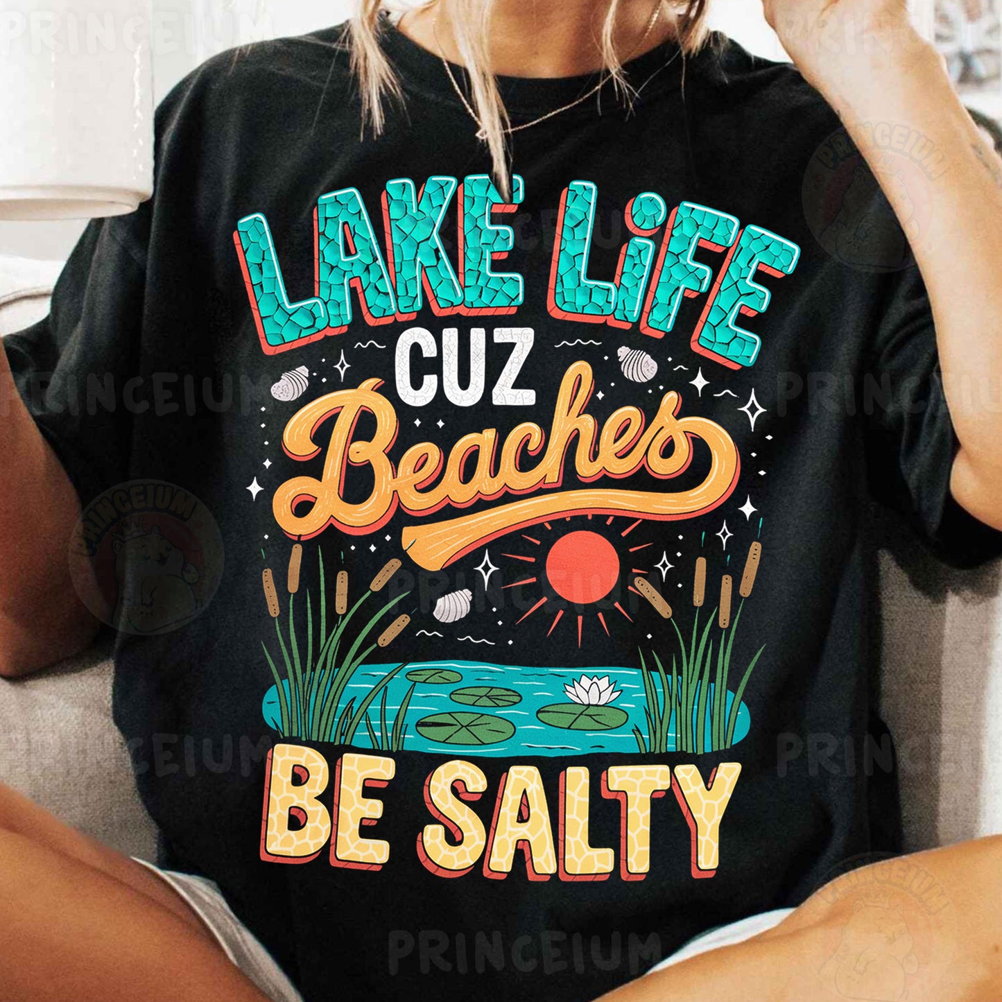 a woman sitting on a couch wearing a lake life t - shirt