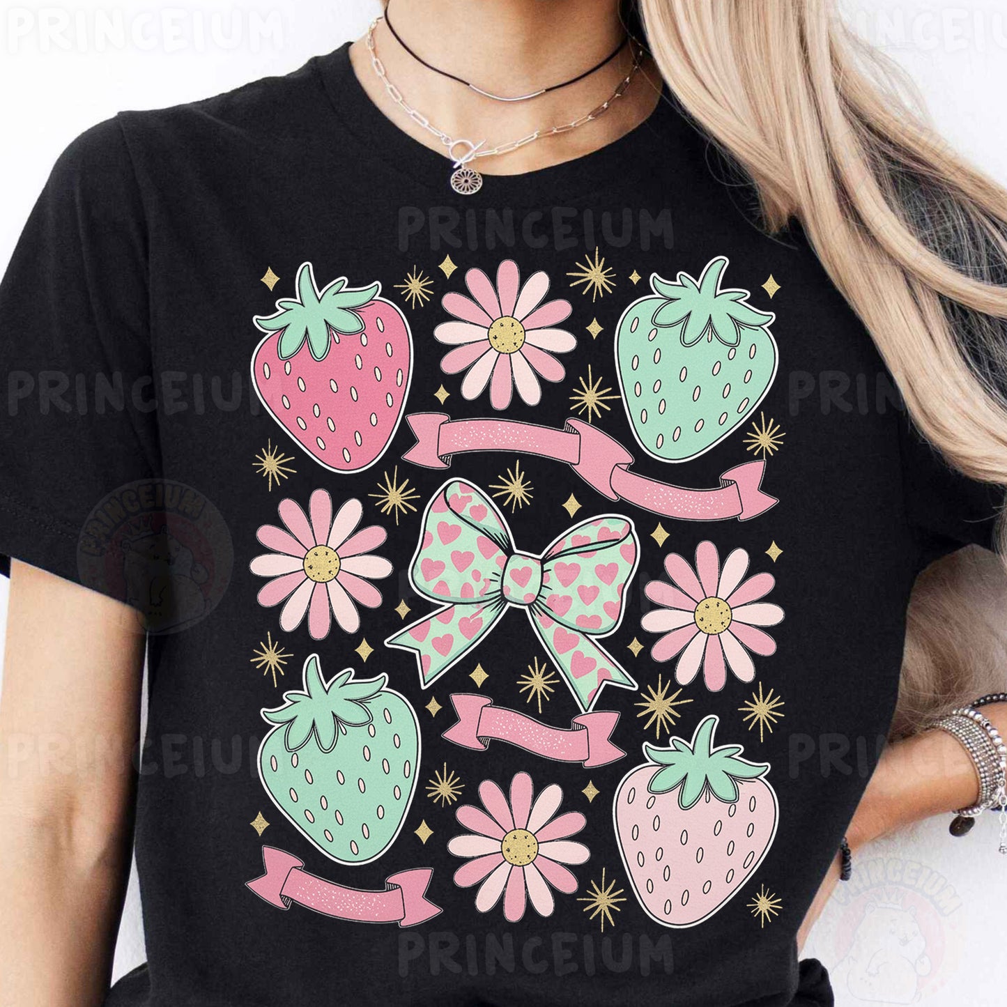a woman wearing a black tshirt with pink flowers and strawberries on it