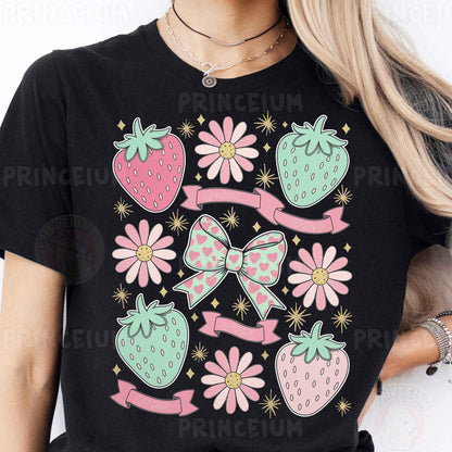 a woman wearing a black tshirt with pink flowers and strawberries on it