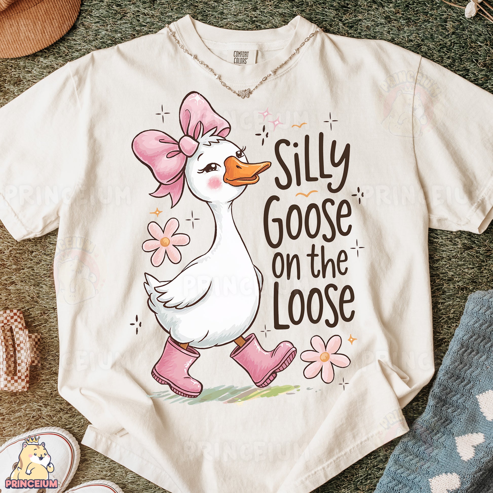 a white t - shirt with a pink bow on it