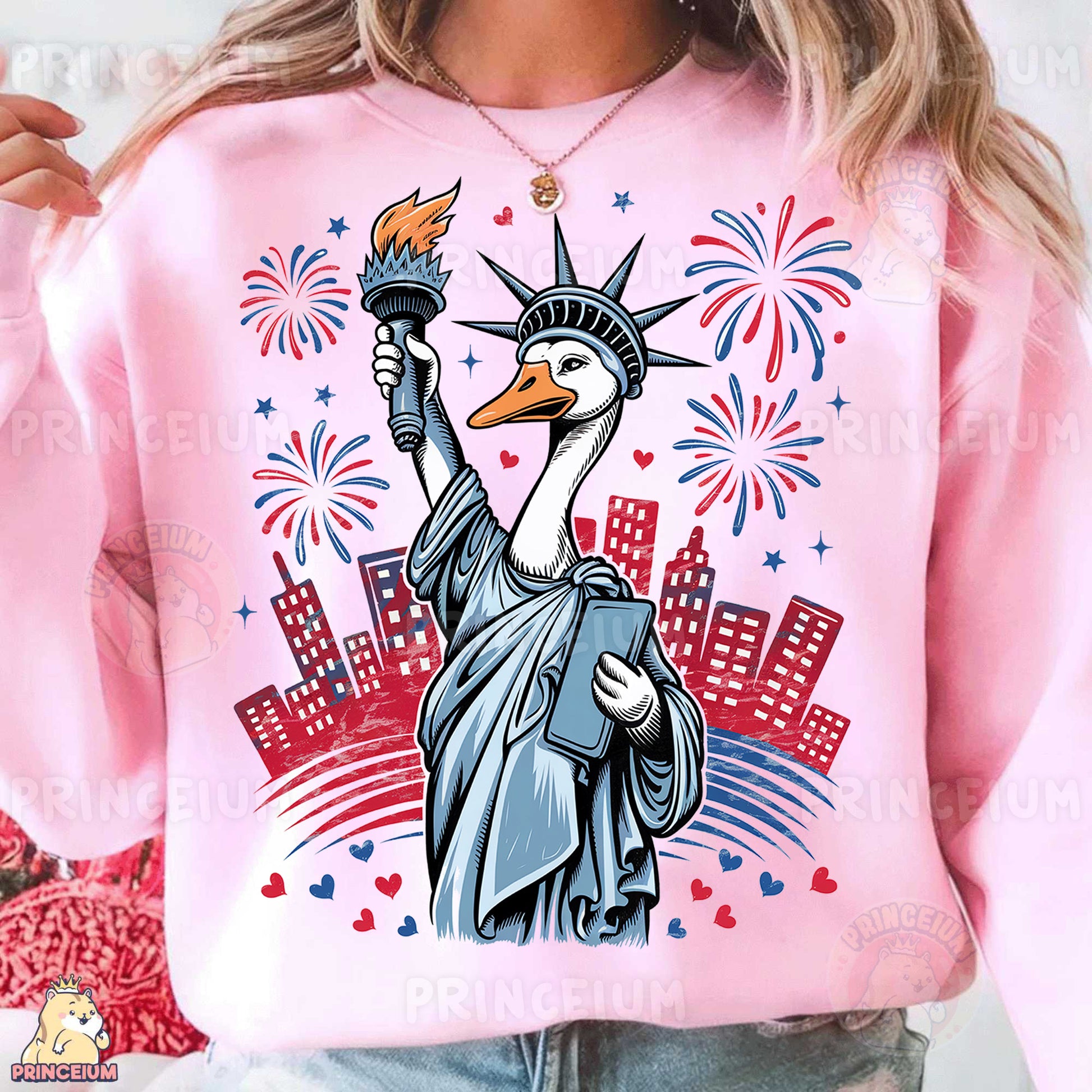 a woman wearing a pink sweatshirt with the statue of liberty on it