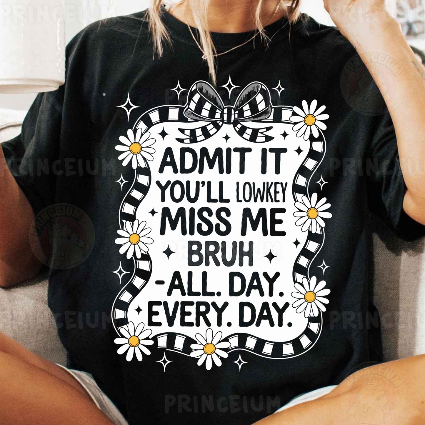 a woman sitting on a couch wearing a t - shirt that says admit it you
