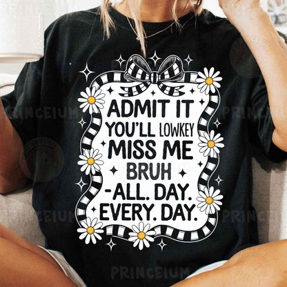 a woman sitting on a couch wearing a t - shirt that says admit it you