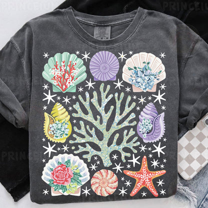 a t - shirt that has a bunch of seashells on it