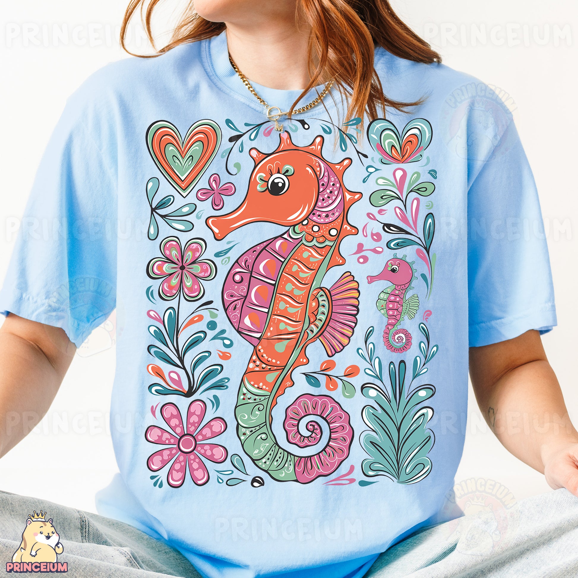 a woman wearing a blue shirt with a sea horse on it