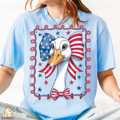 a woman wearing a blue shirt with a picture of a duck on it