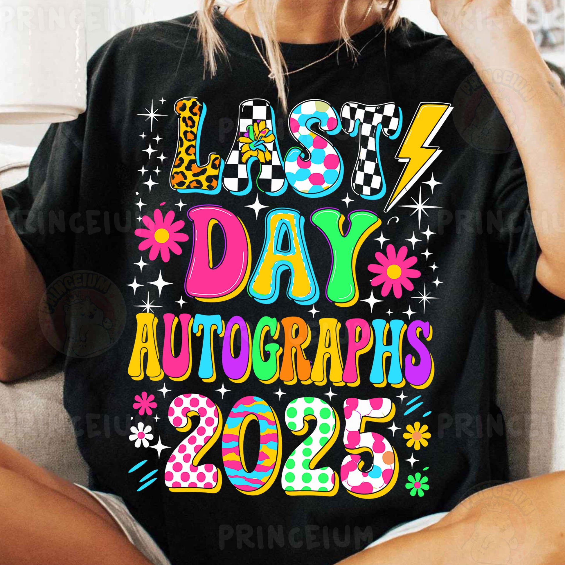 a woman sitting on a couch wearing a t - shirt that says last day auto
