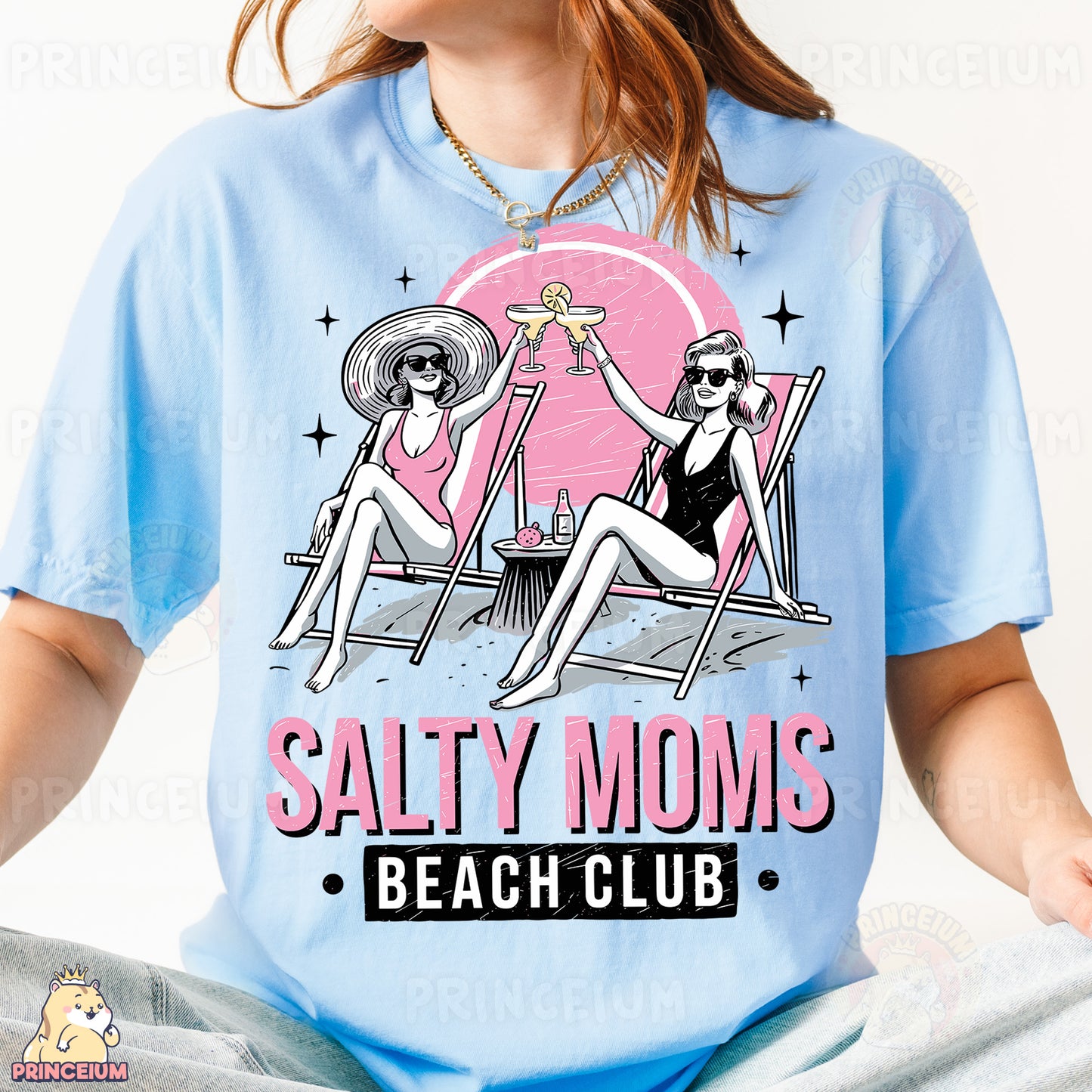 a woman sitting on a beach chair wearing a t - shirt saying salty moms