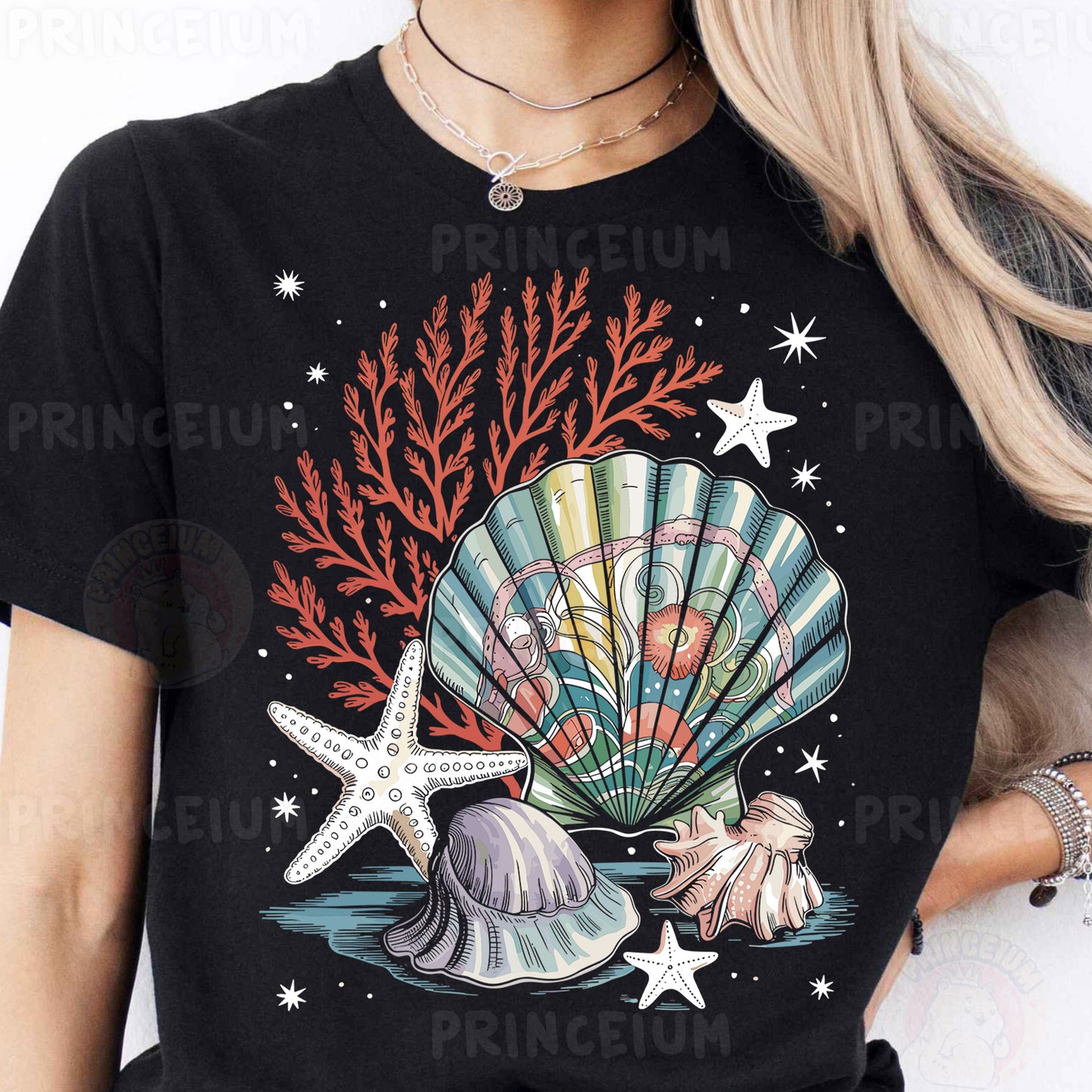 a woman wearing a black t - shirt with a seashell and starfish on