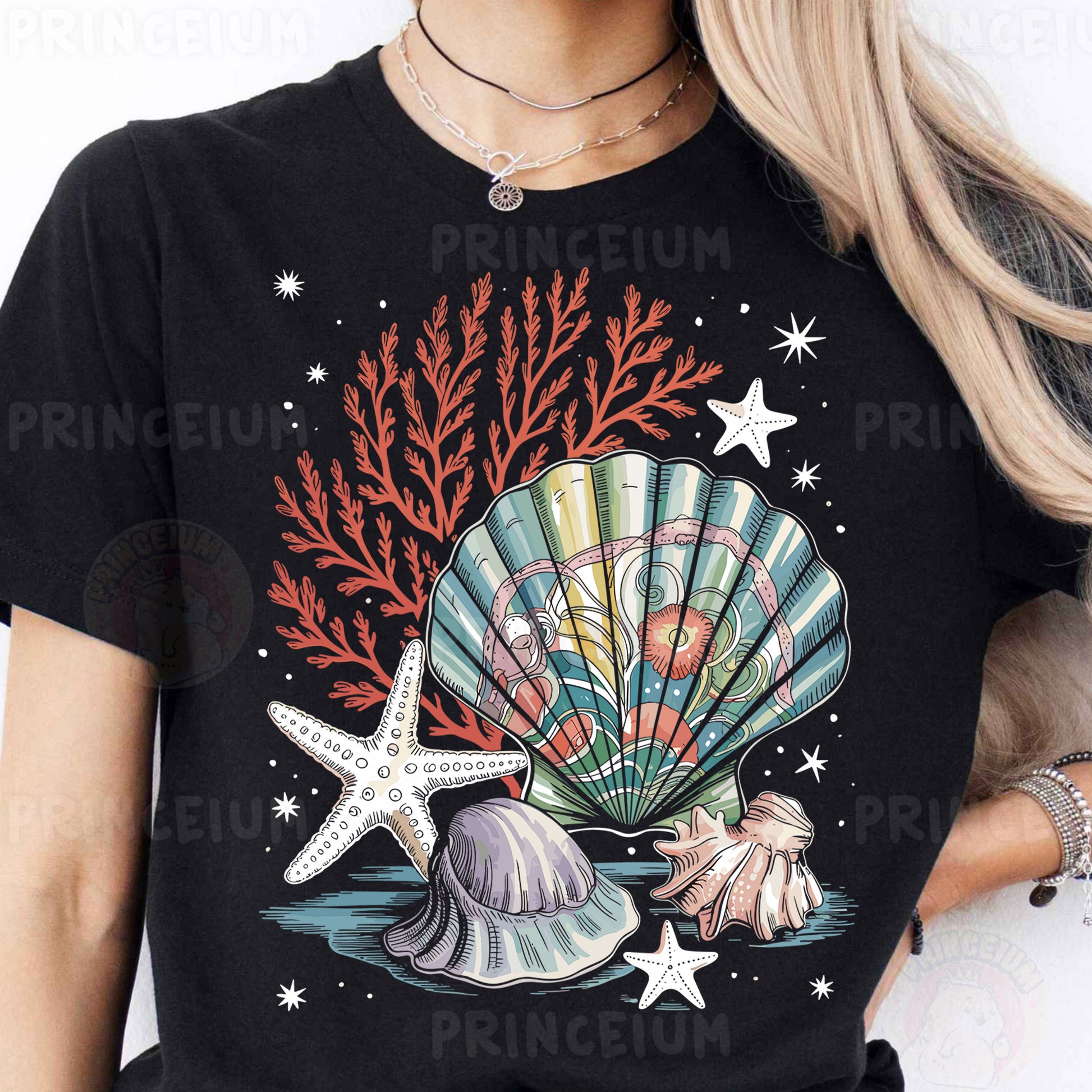 a woman wearing a black t - shirt with a seashell and starfish on