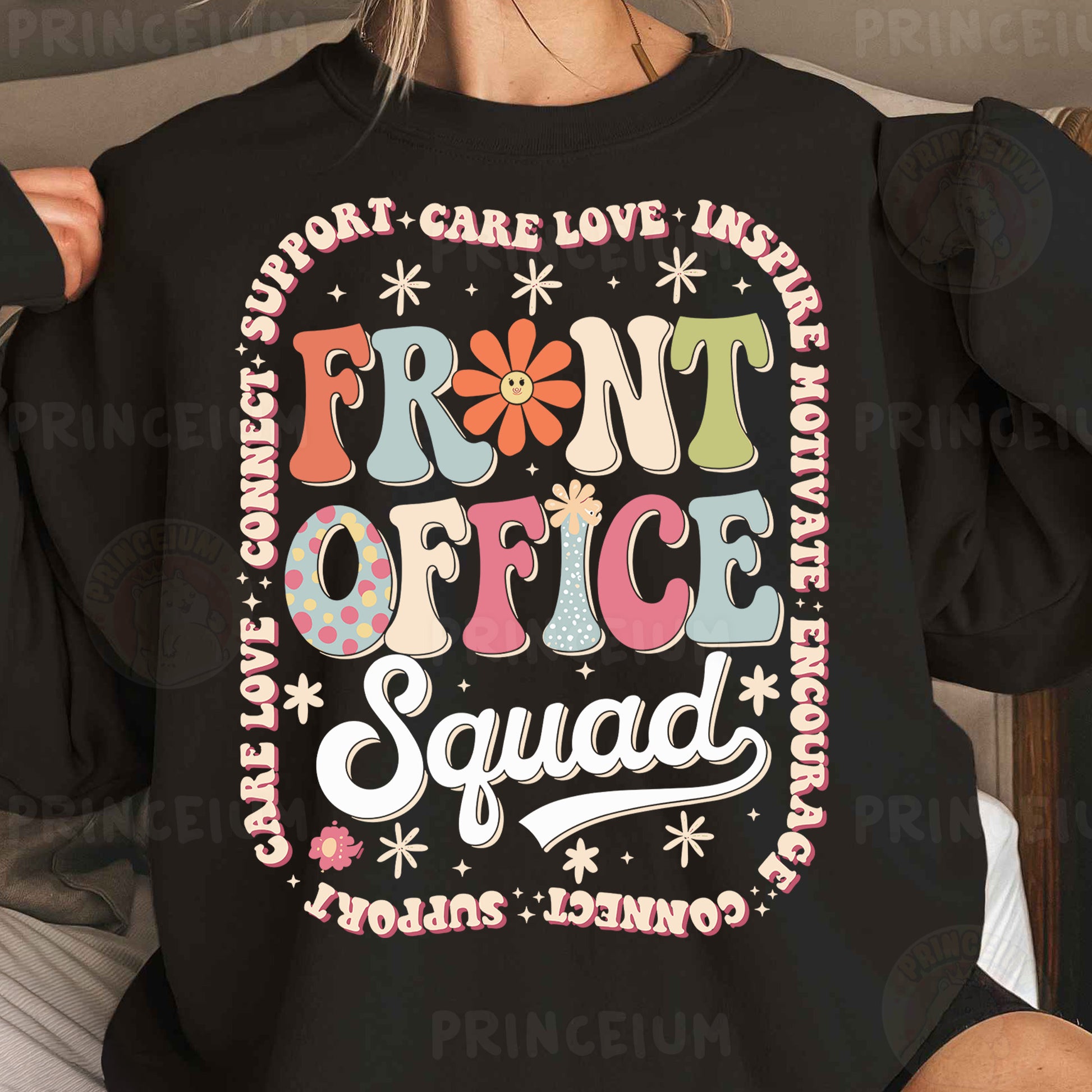 a woman wearing a black shirt that says front office squad