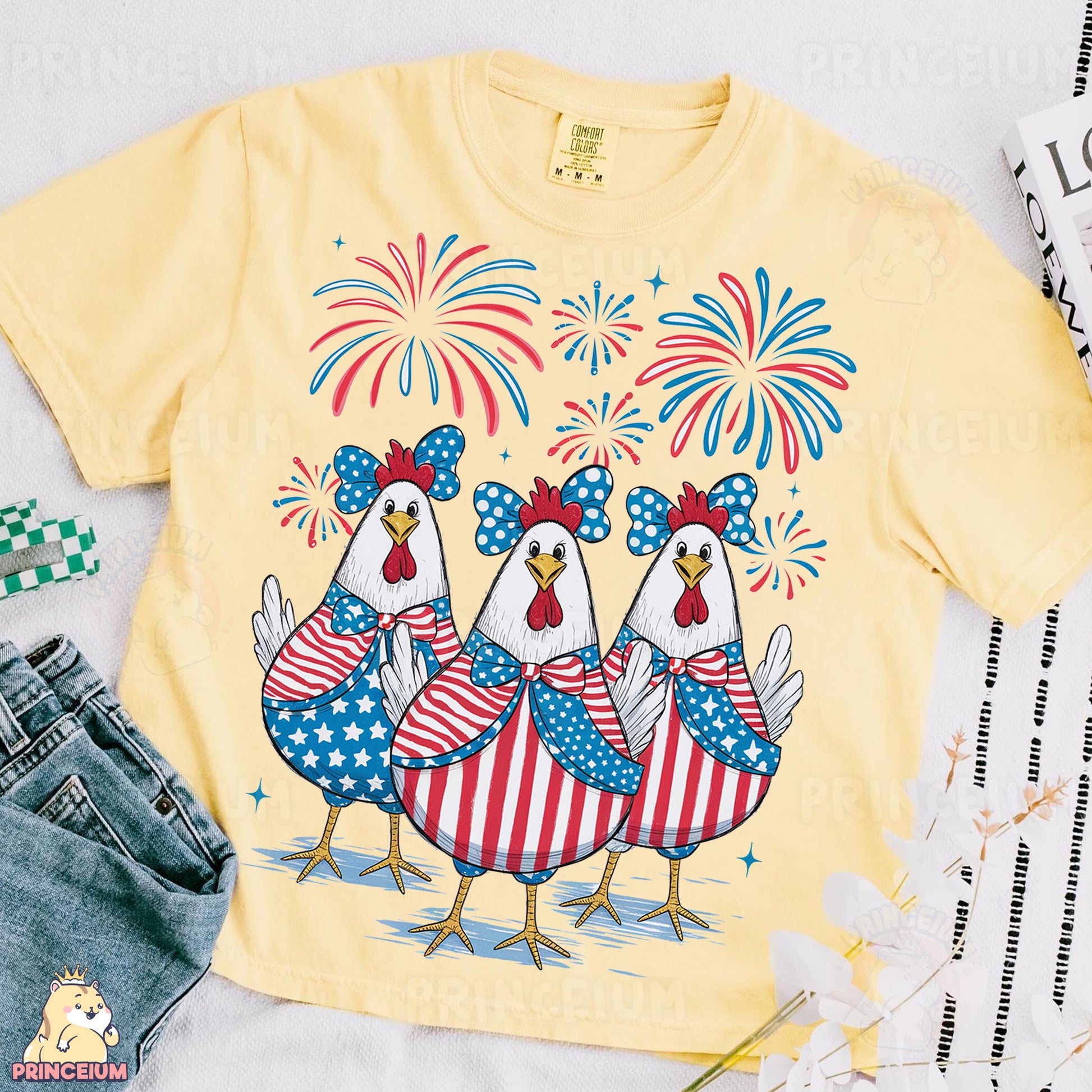 a yellow shirt with three chickens on it