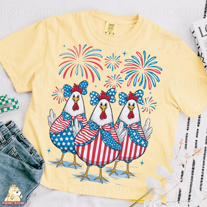 a yellow shirt with three chickens on it