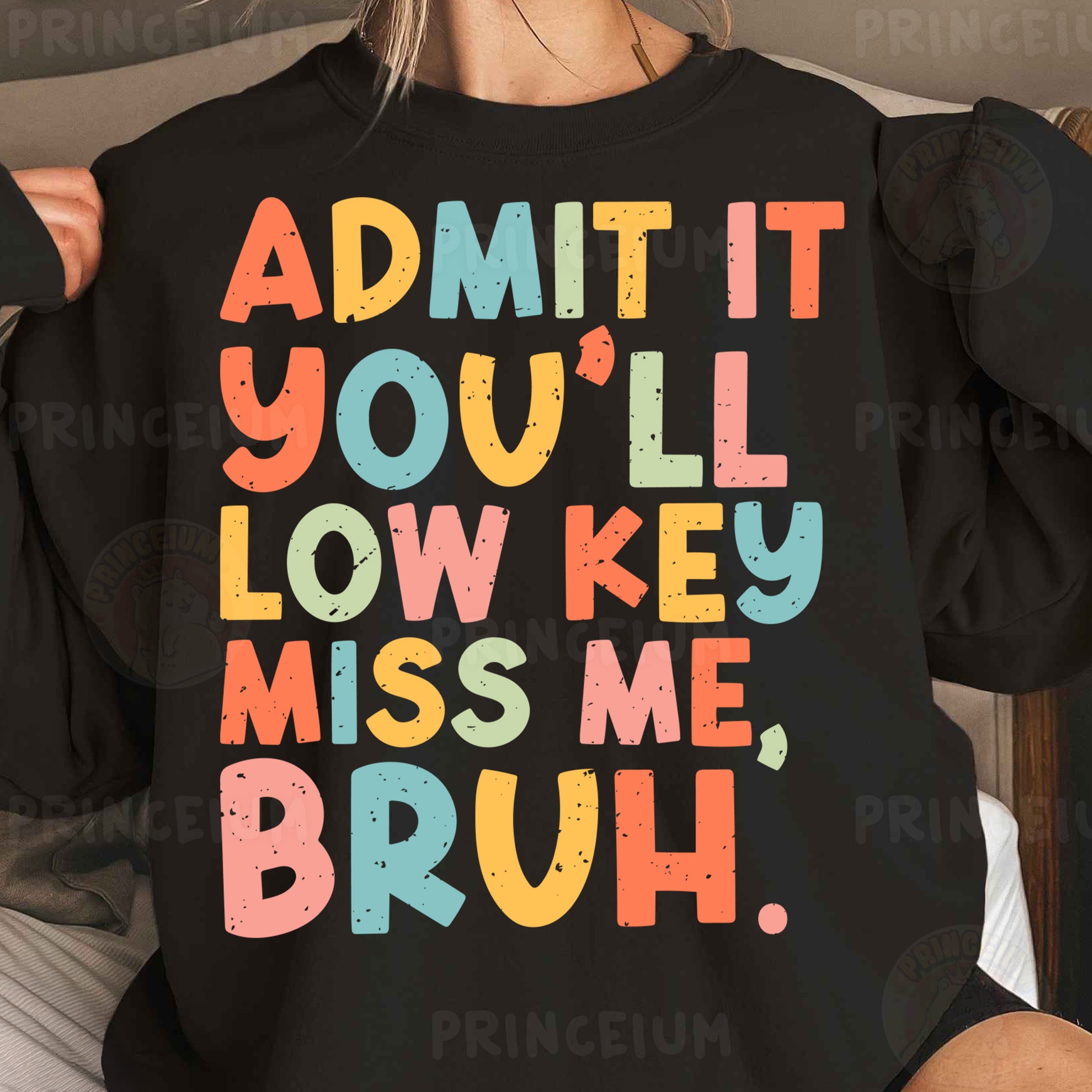 a woman wearing a black sweatshirt that says admit you'll low key miss me